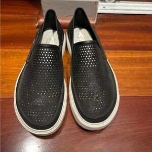 Croc black slip ons
